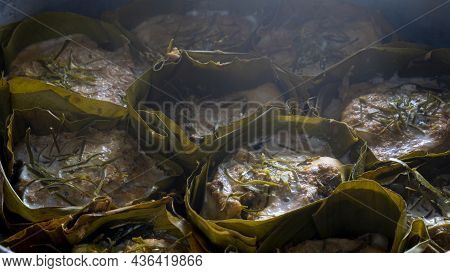 Close-up Of Thai Steamed Curry Fish In Banana Leaf Cups Or Thailand Name Hor Mok Pla. Steaming Until
