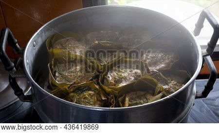 Thai Steamed Curry Fish In Banana Leaf Cups Or Thailand Name Hor Mok Pla. In Side Kitchen Implement 