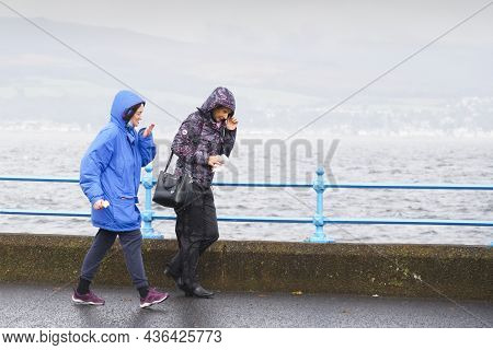 Greenock, Inverclyde, Scotland, Uk, October 2nd 2021, Elderly Women Walking In Heavy Rain During Bri