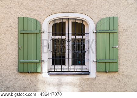 Barred Window With Shutter Outdoor On A House