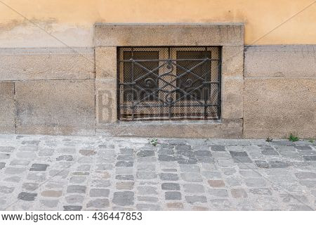 Old Rusty Cellar Window With Iron Grating