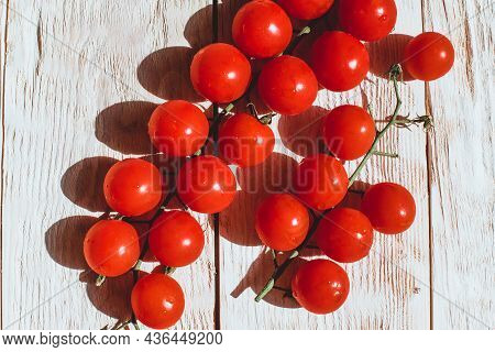 Cherry Tomatoes On Wooden Table Background With Copy Space