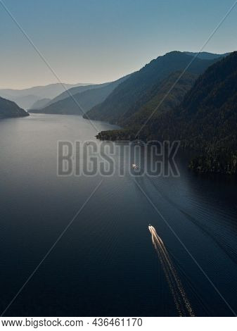 Motor Boat Moored To The Shore Of A Mountain Lake. Russia, Altai Republic, Ulagansky District, Lake 