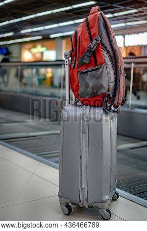 Stack Of Suitcases Bagpack In Departure Airport Terminal In Lounge Shopping Store In Background. Pas