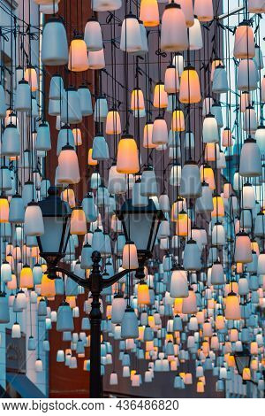 Street Lights On Stoleshnikov Lane. Moscow Pedestrian Street. Lights In The Dark. Beautiful Backligh