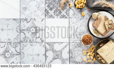 Tasty Eastern Sweet Dessert Halva From Cocoa And Cashew Onon A Gray Tile Background.traditional Dess