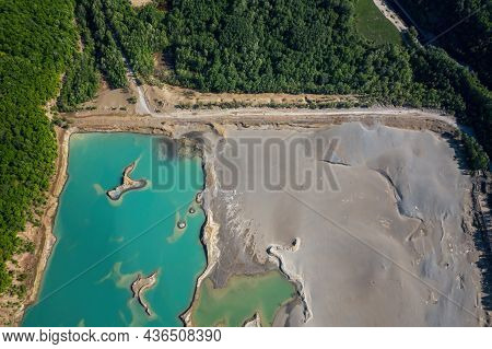 Drone View Of The Turquoise Lake Formed As A Result Of Mining Waste