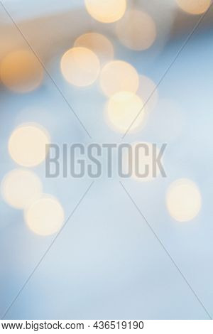 Many Blurred Small Electric Bulbs On A Wall. Yellow Blurred Lights. Wall Of Christmas Lights