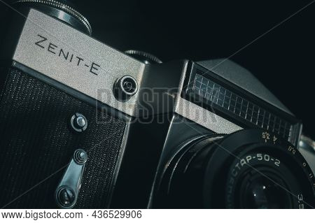 Soviet Film Camera Zenit-e With Industar 50-2 Lens. Tilted Composition, Close-up
