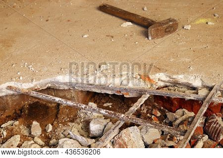 Dismantling, Disassembling The Floor. Smashed Concrete And Bricks Floor. Destroying Concrete Surface