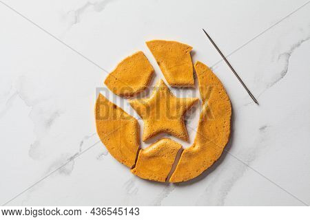 Dalgona Candy - South Korean Treat. Round Sugar Cookie With A Star Inside, Top View.
