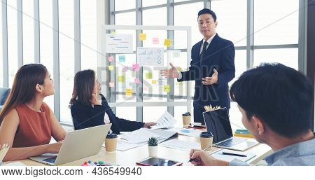 Happy Business People Meeting Present Graph Chart Investment, Business Data In Meeting Room. Group O