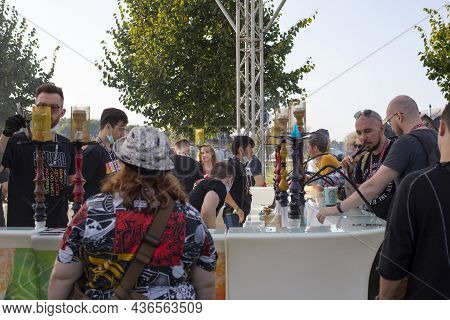 Moscow, Russia - August 28, 2021: Johncalliano Fest 2021 Open Air Hookah Festival. People Are Trying