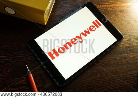 Kyiv, Ukraine - August 21, 2021. Honeywell Company Logo And Yellow Folder.