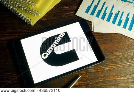 Kyiv, Ukraine - August 21, 2021. Tablet With Cummins Company Logo And Business Papers.