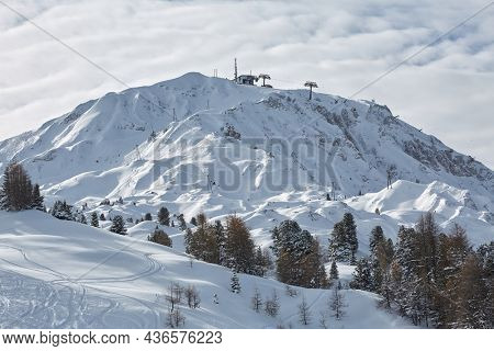 Winter snowy landscape with high mountains, ski slopes of Paradiski France