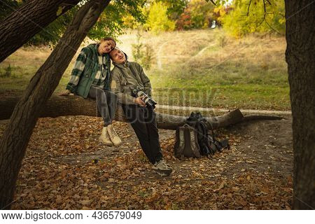 Full-length Portrait Of Beautiful Young Couple Speding Time Together, Hiking. Forest Landscape