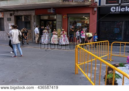 Burriana, Spain 10-10-2021: Portrait Of Falleras Women, Wearing The Traditional Costume Of Fallas