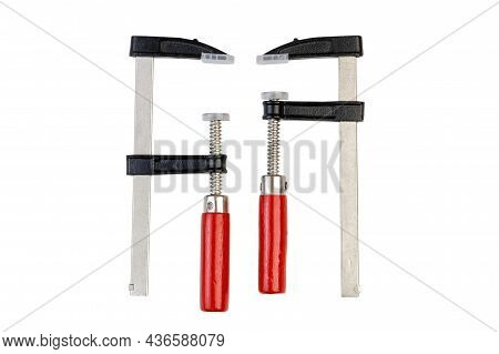 Two Carpentry Clamps With Red Wooden Handles Isolated On White Background With A Clipping Path.