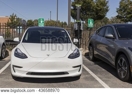 Indianapolis - Circa October 2021: Tesla Ev Electric Vehicle On Display At A Blink Ev Charger. Tesla