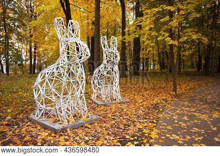 Moscow, Russia, October, 2021: Two Rabbits In Autumn Park. Sculpture By Cedric Le Borgne In Vdnkh Pa