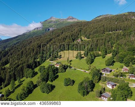 Panoramic View On Mountain Villages, Green Forests And Apline Meadows Near Saint-gervais-les-bains,