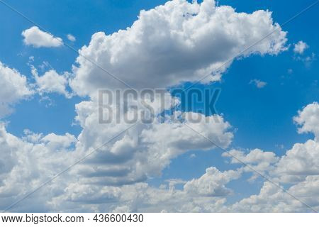 Beautiful Blue Sky With Whipped White Clouds That Are Illuminated By The Sun.
