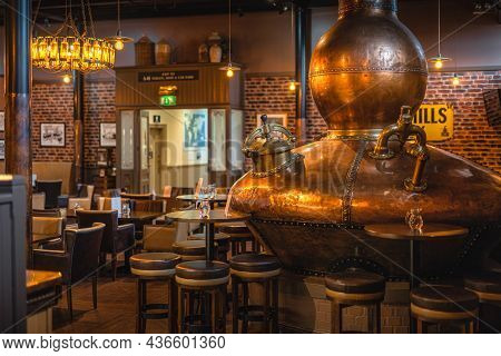 Bushmills, Northern Ireland, Aug 2019 Large, Copper Fermentation Vat In Bushmills Whiskey Bar As Dec