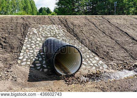 A New Modern Plastic Culvert Under The Highway With A Decorative Cobblestone Finish