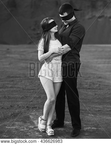 Romantic Couple Blindfolded With Black Ribbon. Love Blind Concept. Black And White
