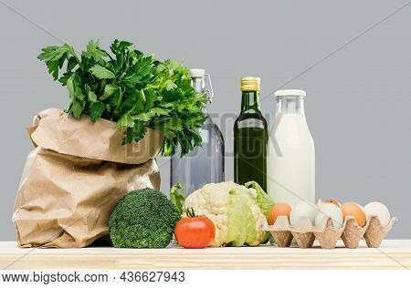 Grocery. Bag With Greenery Vegetables And Dairy Produce