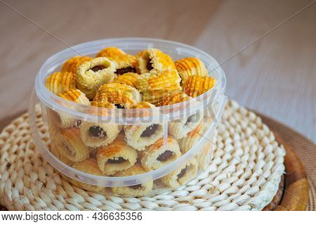 Traditional Pineapple Jam Tart Roll Cookies Or A Malay Called Tart Nanas In A Plastic Container.