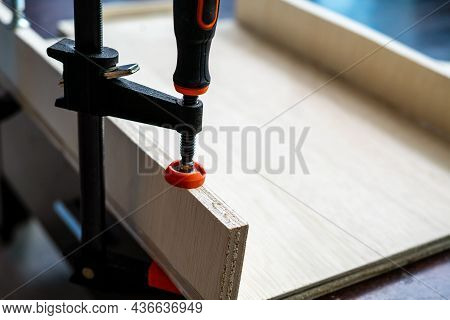 Wood Working. Fine Quality Hardwood Lumber, Ready For Use. F-clamp Holding On Lumber.