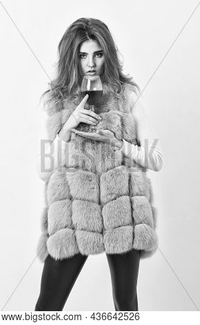 Girl Fashion Makeup Wear Fur Coat Hold Wine Glass. Lady Fashion Model Curly Hairstyle Likes Expensiv