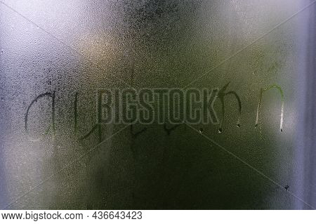 Foggy Glass On A Window With Written Finger Word Autumn. Concept Photo With Copy Space