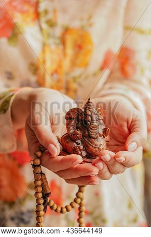 Young Woman With Lord Ganesha Sclupture In Her Hands Celebrate Ganesha Festival.