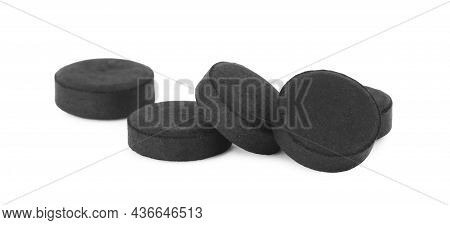 Activated Charcoal Pills On White Background. Potent Sorbent