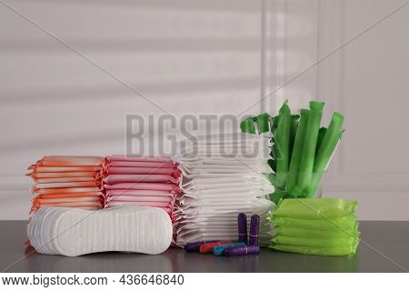 Many Different Menstrual Pads, Tampons And Pantyliners On Table