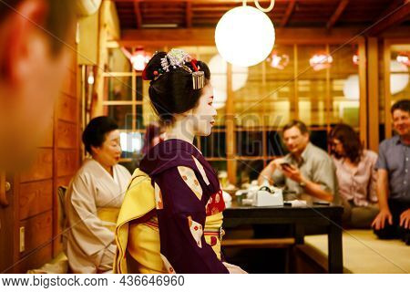 Kyoto, Japan - 18 May, 2015: Maiko Apprentice Showing Japanese Traditional Dance. Maiko Is An Appren