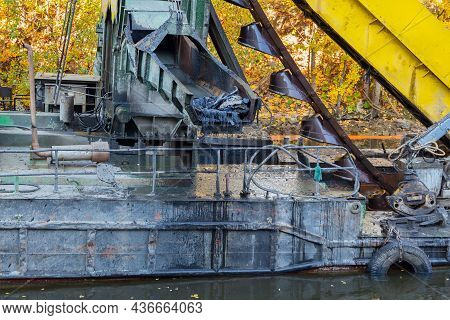 Dredger At Work On Deepening The River Bottom From Silt And Debris