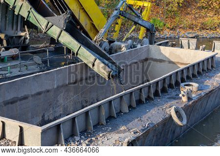 Dredger At Work On Deepening The River Bottom From Silt And Debris