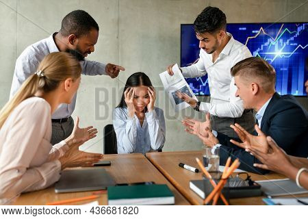 Conflicts At Work. Asian Female Suffering From Mobbing And Bullying In Office