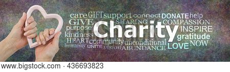 Give To Charity With All Your Heart Campaign Word Cloud -  Female Hands Holding A Pale Pink Heart Sh