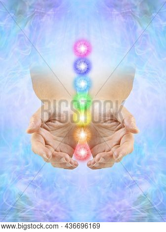 Sending You Chakra Healing Energy -  Cupped Hands Emerging From Ethereal Blue Energy Field With A Co