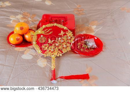 Accessories In A Chinese Wedding. A Fan For The Bride At A Wedding Is Object That Represents Good Me