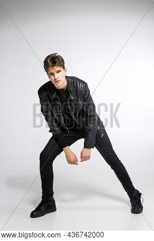 Full Body Image Of Model Appearance Of Young Fashionable Guy In Leather Jacket And All Black Clothes