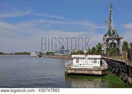 Kazan, Russia - August 7, 2021. View Of The Kazan River Port On The Volga River. Portal Crane On The