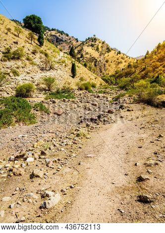 Dry river bed and a trail in Hissar Valley in Tajikistan