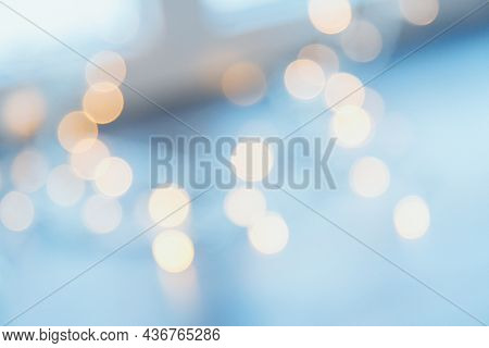 Many Blurred Small Electric Bulbs On A Wall. Yellow Blurred Lights. Wall Of Christmas Lights