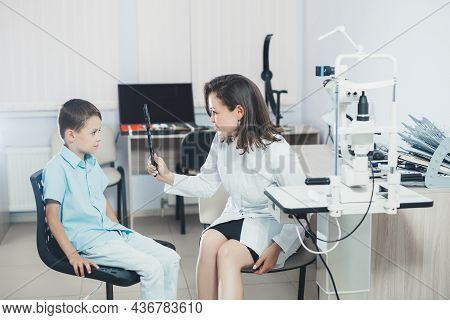 Ophthalmologist Checks The Boy's Vision. Hyperopia. Vision Tests In Children.